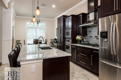 Eat-in kitchen - single-wall gray floor eat-in kitchen idea in Miami with an undermount sink, recessed-panel cabinets, dark wood cabinets, multicolored backsplash, stainless steel appliances, an island and gray countertops