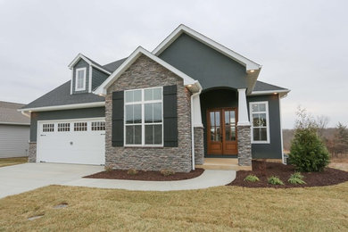 Example of a mid-sized transitional gray two-story concrete fiberboard house exterior design in Other