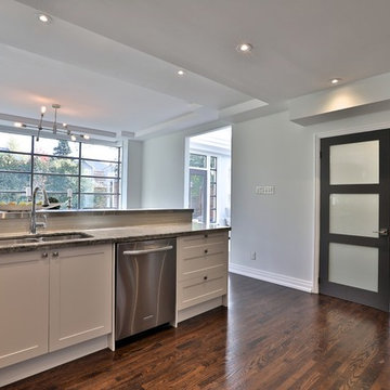 Shaker style kitchen and granite countertop in Toronto