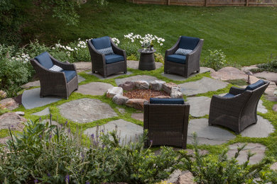 Inspiration for a traditional backyard patio in DC Metro with a fire feature and natural stone pavers.
