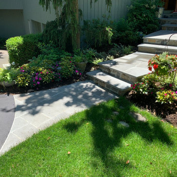 Walkway, retaining walls, plantings and stone stairs and front stoop
