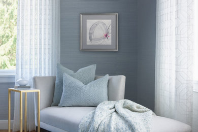 Large transitional guest light wood floor and beige floor bedroom photo in Chicago with blue walls