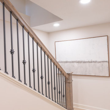 Warm & Inviting Basement Retreat with Custom Bar + Entertainment Center