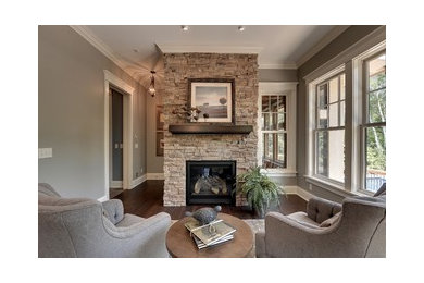 Design ideas for a traditional family room in Chicago with a standard fireplace and a stone fireplace surround.