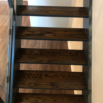 Luxury Vinyl, Baseboard and Custom Oak Staircase