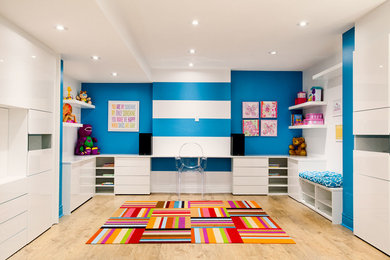 Kids' room - large contemporary gender-neutral light wood floor kids' room idea in Toronto with multicolored walls