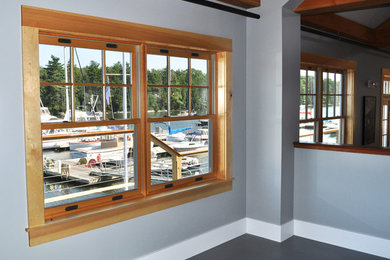 Mid-sized beach style dark wood floor living room photo in Boston with no fireplace and gray walls
