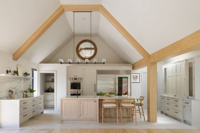 Design ideas for an expansive contemporary single-wall open plan kitchen in Hertfordshire with a built-in sink, shaker cabinets, white cabinets, marble worktops, white splashback, marble splashback, stainless steel appliances, ceramic flooring, an island, grey floors, white worktops and a vaulted ceiling.