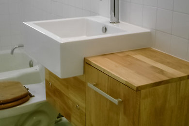 Inspiration for a modern white tile bathroom remodel in Austin with white walls
