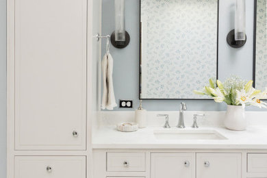 Bathroom - mid-sized coastal master white tile mosaic tile floor bathroom idea in Portland with shaker cabinets, white cabinets, an undermount sink, quartz countertops, a hinged shower door, white countertops and a freestanding vanity