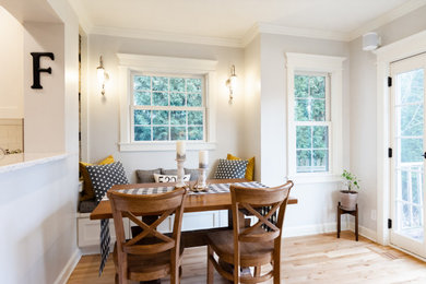 Example of a mid-sized transitional medium tone wood floor and beige floor kitchen/dining room combo design in Milwaukee with gray walls