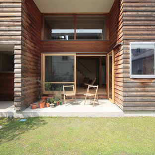 他の地域のアジアンスタイルのおしゃれな中庭のテラス (コンクリート敷き	、張り出し屋根) の写真