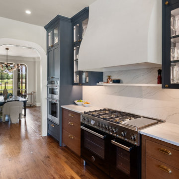 Sculptural Plaster Hood and Arched Pantry Entryway