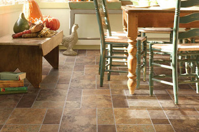 Slate floor dining room photo in Charlotte with beige walls