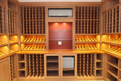 Mid-sized elegant light wood floor wine cellar photo in New York