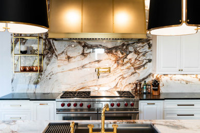 Example of a mid-sized transitional kitchen design in Other with marble countertops, white backsplash, marble backsplash, an island, white countertops, recessed-panel cabinets, white cabinets and stainless steel appliances