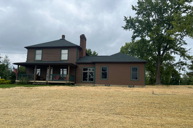 Home design - country home design idea in Cleveland