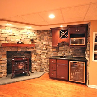 Photo of a traditional basement in New York with a corner fireplace.