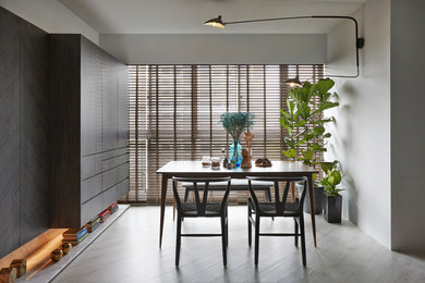 Photo of a scandinavian dining room in Singapore with grey walls and vinyl floors.