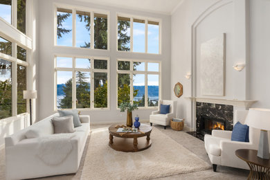 This is an example of an expansive transitional formal living room in Seattle with grey walls, carpet, a stone fireplace surround, no tv and grey floor.
