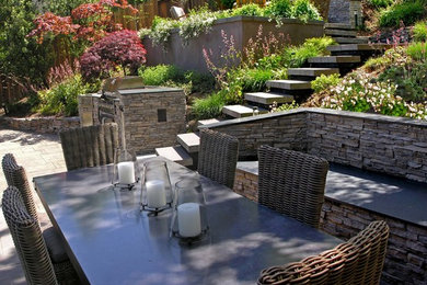 Inspiration for a large country backyard patio in San Francisco with an outdoor kitchen, natural stone pavers and no cover.