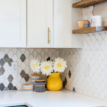 Kitchen tow tone cabinets and fun mosaic backsplash