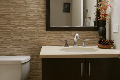 Bathroom - small 3/4 beige tile and stone tile ceramic tile and single-sink bathroom idea in Chicago with flat-panel cabinets, dark wood cabinets, a two-piece toilet, beige walls, an undermount sink, quartz countertops, beige countertops and a freestanding vanity