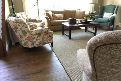 Living room - traditional open concept medium tone wood floor living room idea in St Louis with beige walls