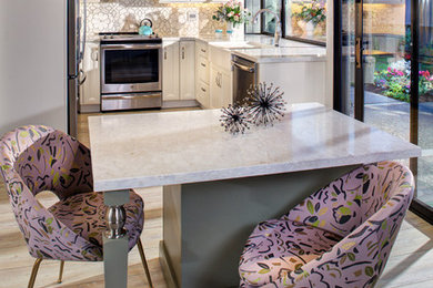 Eat-in kitchen - small transitional u-shaped vinyl floor and gray floor eat-in kitchen idea in Sacramento with a farmhouse sink, recessed-panel cabinets, white cabinets, quartz countertops, white backsplash, mosaic tile backsplash, stainless steel appliances, an island and white countertops