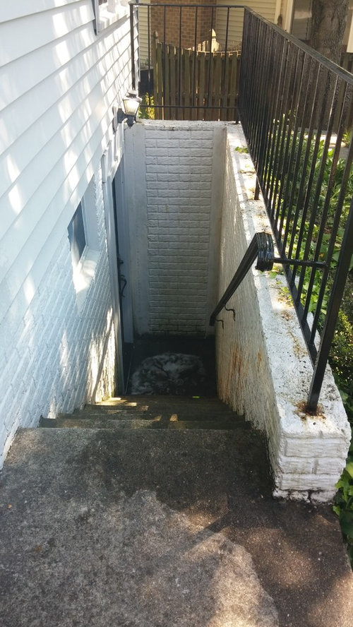 Entrance To A Basement Apartment, Outdoor Gate For Basement Stairs Design