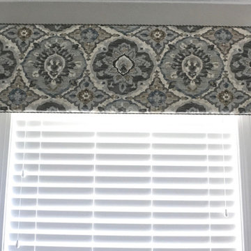 Statement cornice over master tub.