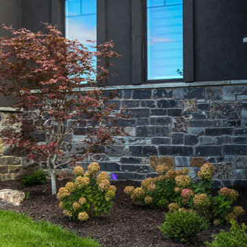 Rustic Stone Wall with Mulch, Flowers and Trees