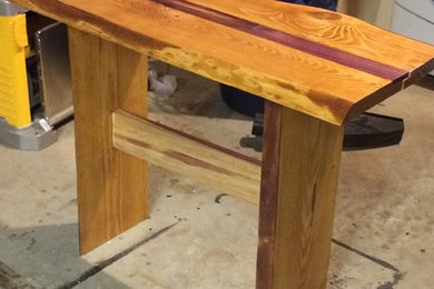 Live edge hemlock accent table with red cedar support bar red cedar inlay