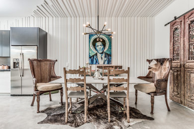 Inspiration for a small transitional concrete floor and gray floor kitchen/dining room combo remodel in Houston with white walls