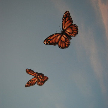 Sky Ceiling Mural with Butterflies, hand-painted in a bedroom by Mural Art LLC.