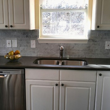 Caesarstone Piatra Grey Quartz Countertop with Carrara Marble Subway Tile