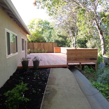 Cantilevered deck to extend small patio in back yard