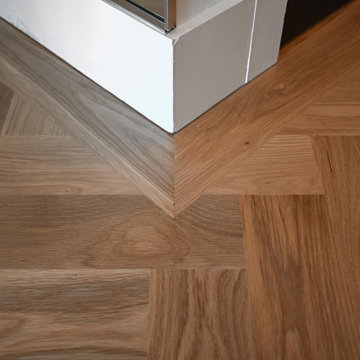 White Oak Herringbone — Border and Miter Detail, Buckhead High-Rise Atlanta