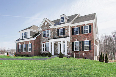 Inspiration for a timeless red two-story brick exterior home remodel in DC Metro