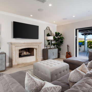 Family Room with Stone Fireplace Opening to Covered Patio – Newport Coast