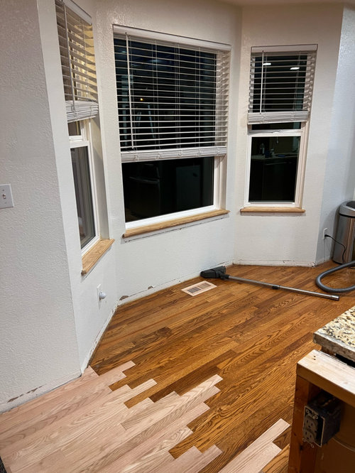 should we stain trim to match wood floors or paint them white?