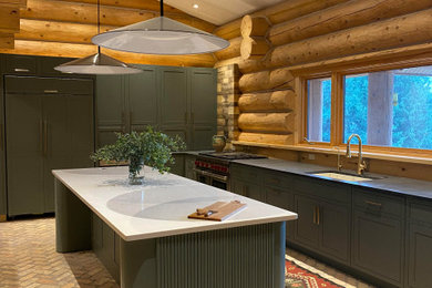 Example of a large trendy l-shaped kitchen pantry design in Denver with shaker cabinets, green cabinets, marble countertops, an island and black countertops