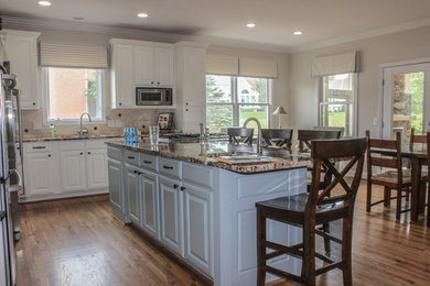 Large elegant dark wood floor and brown floor kitchen/dining room combo photo in Cincinnati with brown walls and no fireplace