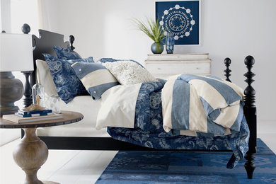 Example of a mid-sized beach style master painted wood floor bedroom design in Orlando with white walls