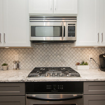 Kitchen | Two-Tone Cabinets | Cambria Quartz | Arabesque Marble Backsplash