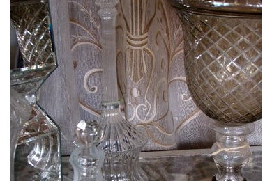 Italian linen drapery panels with crystal accessories in Fino Lino showroom.