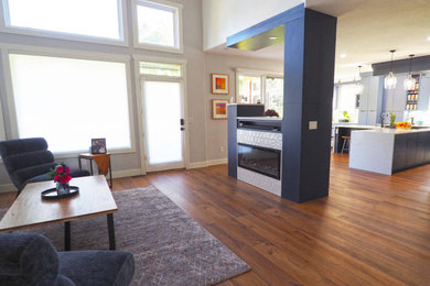 Inspiration for a large contemporary brown floor entryway remodel in Denver with white walls