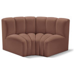 Meridian Furniture - Arc Vegan Leather Upholstered 2-Pc. Inward Curved Modular Sectional, Cognac - Unleash modern opulence with the Arc Vegan Leather 2pc. Sectional. Crafted for the modern connoisseur, this Sectional injects an air of refined luxury into any space. Its sleek silhouette, upholstered in supple cognac vegan leather, exudes timeless sophistication while the deep channel tufting adds textural intrigue, further elevating the chair's visual appeal. The modular design makes it a versatile chameleon, effortlessly adapting to your evolving needs and preferences. Whether you envision it gracing a chic living room corner, basking in the glow of a bedroom window, or adding a touch of drama to a home office, the Arc seamlessly complements your unique interior aesthetic.