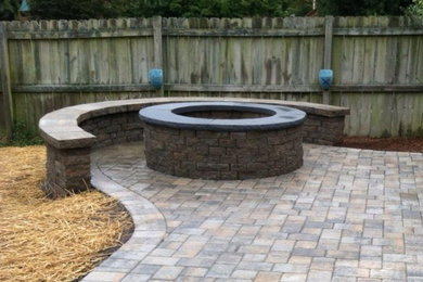 Design ideas for a mid-sized traditional backyard patio in Richmond with a fire feature, no cover and brick pavers.