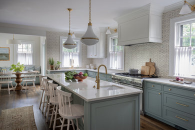 Large transitional u-shaped dark wood floor eat-in kitchen photo in Boston with an undermount sink, shaker cabinets, green cabinets, marble countertops, gray backsplash, ceramic backsplash, stainless steel appliances, an island and white countertops